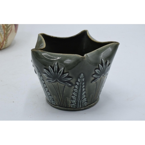 122 - A Doulton Lambeth pentagon-shaped floral vase with green glaze together with Doulton Burslem floral ... 