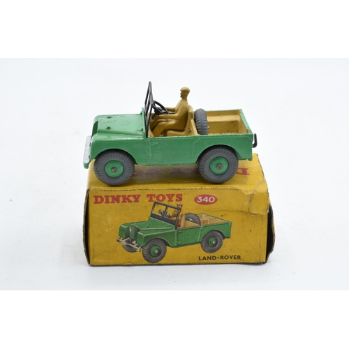 330 - Boxed Dinky Toys No. 340 Land Rover comprising of green body with matching hubs, tan interior and dr... 