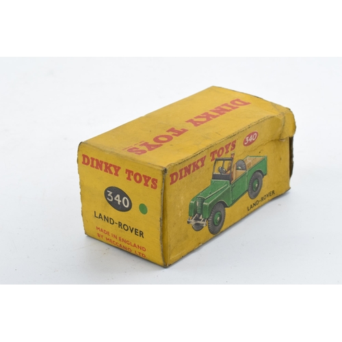 330 - Boxed Dinky Toys No. 340 Land Rover comprising of green body with matching hubs, tan interior and dr... 