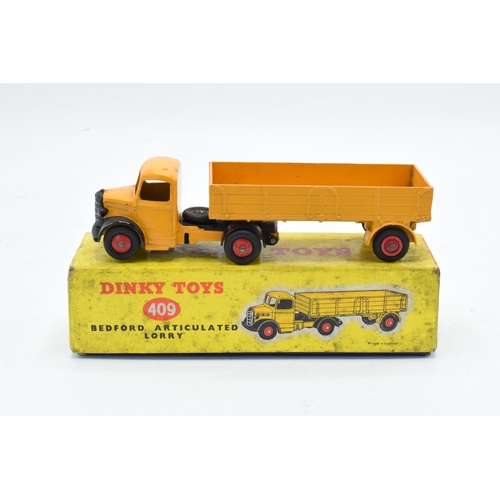 333 - Boxed Dinky Toys No.409 yellow / orange Bedford Articulated Lorry. GC to VGC condition with some pai... 