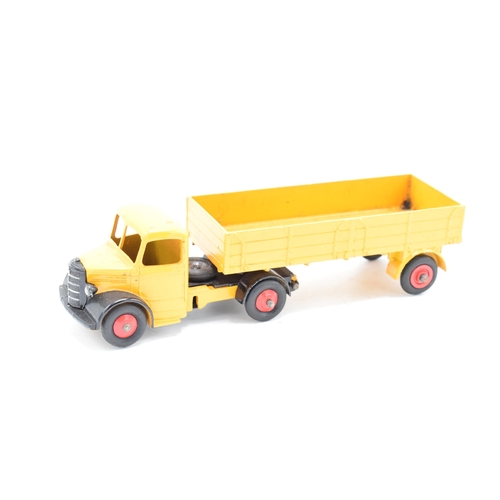 333 - Boxed Dinky Toys No.409 yellow / orange Bedford Articulated Lorry. GC to VGC condition with some pai... 