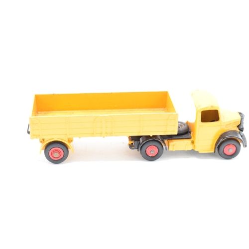 333 - Boxed Dinky Toys No.409 yellow / orange Bedford Articulated Lorry. GC to VGC condition with some pai... 