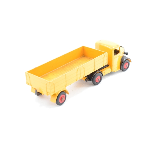 333 - Boxed Dinky Toys No.409 yellow / orange Bedford Articulated Lorry. GC to VGC condition with some pai... 