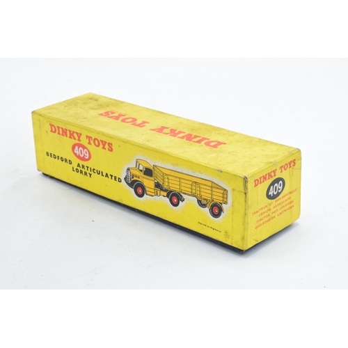 333 - Boxed Dinky Toys No.409 yellow / orange Bedford Articulated Lorry. GC to VGC condition with some pai... 