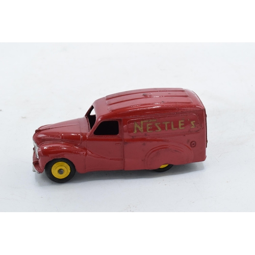 338 - Boxed Dinky Austin Van 'Nestles' No 471. Box taped. In good condition with some evidence of use and ... 