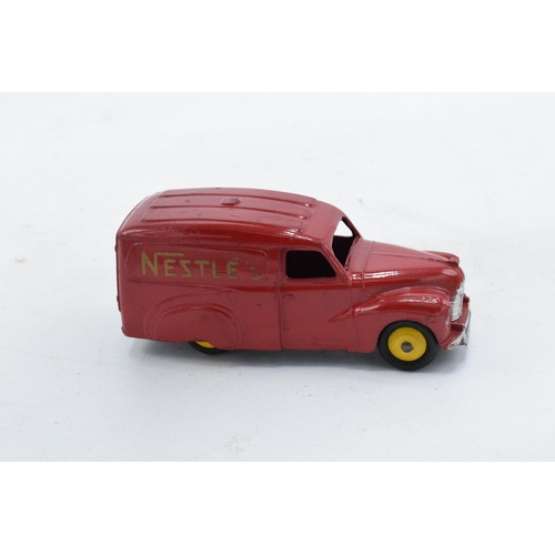 338 - Boxed Dinky Austin Van 'Nestles' No 471. Box taped. In good condition with some evidence of use and ... 