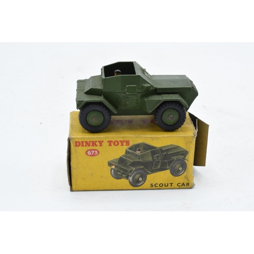 348 - Boxed Dinky Toys 673 Scout Car. In good condition with some evidence of use and play-wear such as sm... 