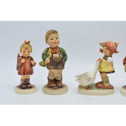 61 - A collection of Goebel / Hummel figures to include What's That?, boy in apple tree, boy with trumpet... 