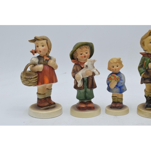 62 - A collection of Goebel / Hummel figures to include Girl with Flowers, boy with chick, girl with bask... 