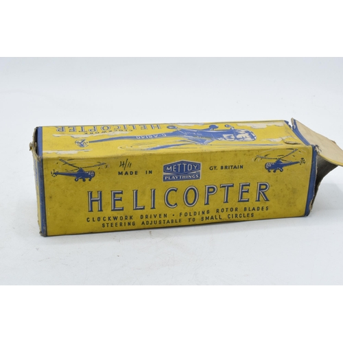 379 - Boxed Mettoy clockwork driven helicopter. Working order. In good condition.