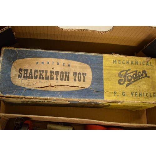 385 - Boxed Shackleton Toys Foden lorry, flat bed Foden truck finished in blue and red with clockwork moto... 