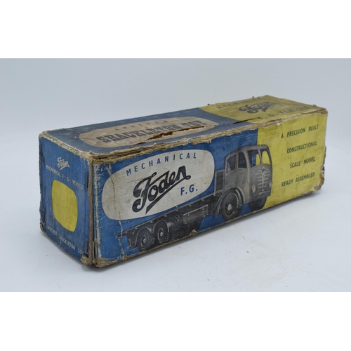 385 - Boxed Shackleton Toys Foden lorry, flat bed Foden truck finished in blue and red with clockwork moto... 