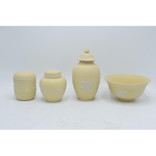 74 - A collection of Wedgwood yellow Jasperware to include a 15cm diameter bowl, 2 lidded pots and a tall... 