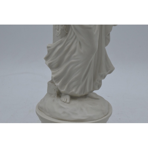 76 - An unusual Coalport figure of a robed lady playing the harp in a Parian / Wedgwood style. 27cm tall.... 