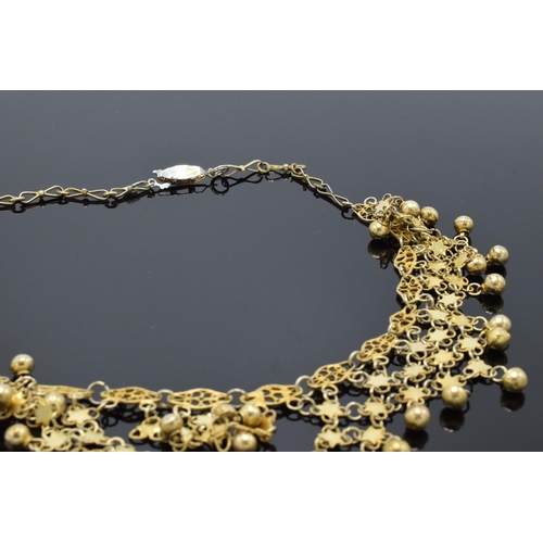 221K - A gilt metal decorative necklace. 45cm long.