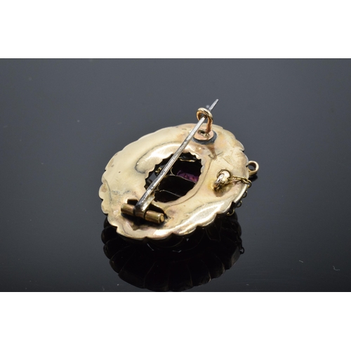 221L - Victorian gold brooch set with 3 large garnets and safety chain. Gross weight 5.6 grams.