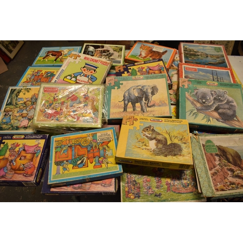 348 - A large collection of Victory and similar childrens wooden jigsaw puzzles from the mid 20th century ... 