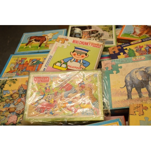 348 - A large collection of Victory and similar childrens wooden jigsaw puzzles from the mid 20th century ... 