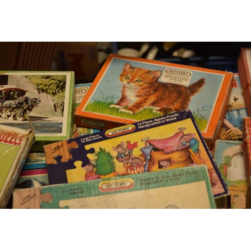 348 - A large collection of Victory and similar childrens wooden jigsaw puzzles from the mid 20th century ... 