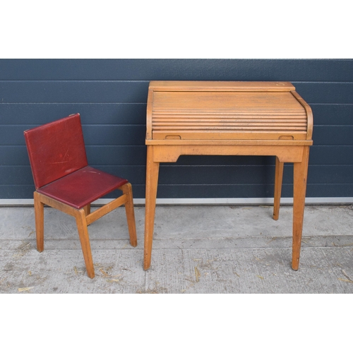 354 - A vintage mid 20th century roller-top children's desk and chair 70 x 44 x 82cm tall. In good conditi... 