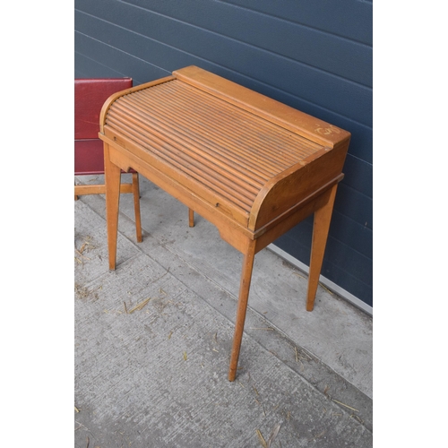 354 - A vintage mid 20th century roller-top children's desk and chair 70 x 44 x 82cm tall. In good conditi... 