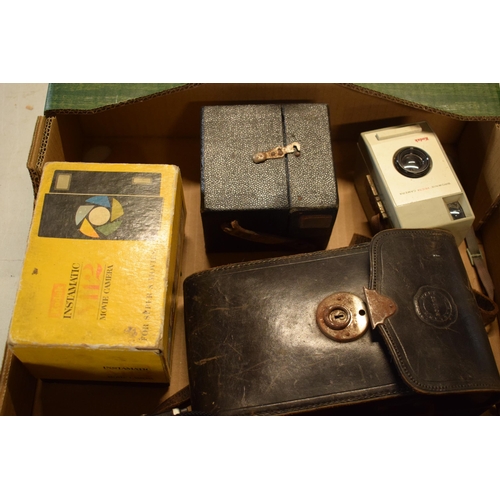 358 - A collection of cameras and camera equipment to include a Houghton camera, various Kodak Brownies, C... 