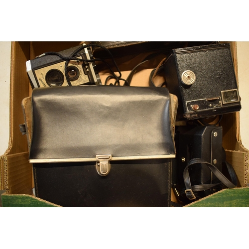 358 - A collection of cameras and camera equipment to include a Houghton camera, various Kodak Brownies, C... 