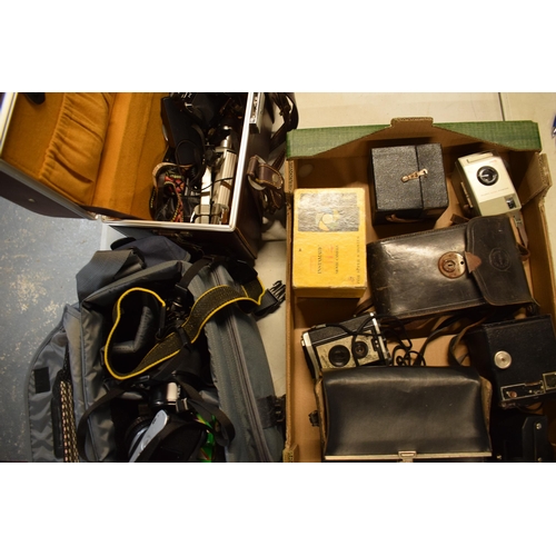 358 - A collection of cameras and camera equipment to include a Houghton camera, various Kodak Brownies, C... 