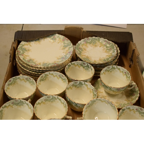 13 - A collection of late 19th / early 20th century tea ware in a green floral pattern to include cups, s... 