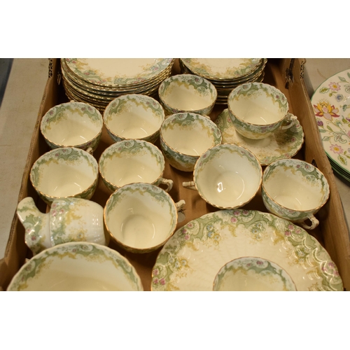 13 - A collection of late 19th / early 20th century tea ware in a green floral pattern to include cups, s... 