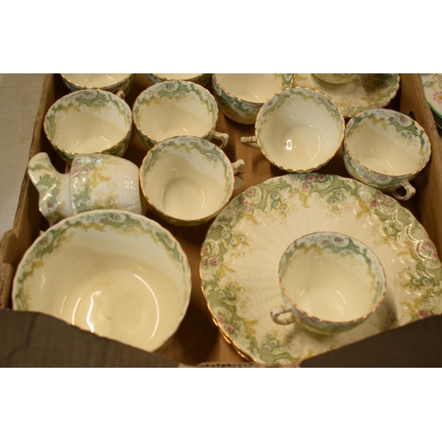 13 - A collection of late 19th / early 20th century tea ware in a green floral pattern to include cups, s... 