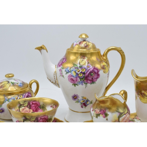 48 - Royal Chelsea English Bone China Golden Rose tea ware to include a coffee pot, 2 cups and saucers, 2... 