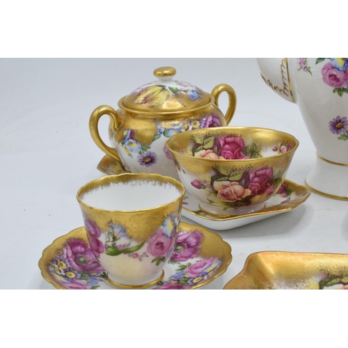 48 - Royal Chelsea English Bone China Golden Rose tea ware to include a coffee pot, 2 cups and saucers, 2... 