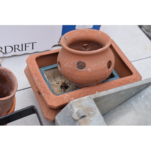 361 - A mixed collection of items to include a galvanised chicken feeder, terracotta pots and others (Qty)... 