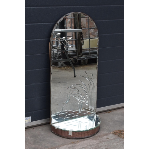 363 - A large domed mirror with mirrored shelf with decoration to main panel. 98cm tall.