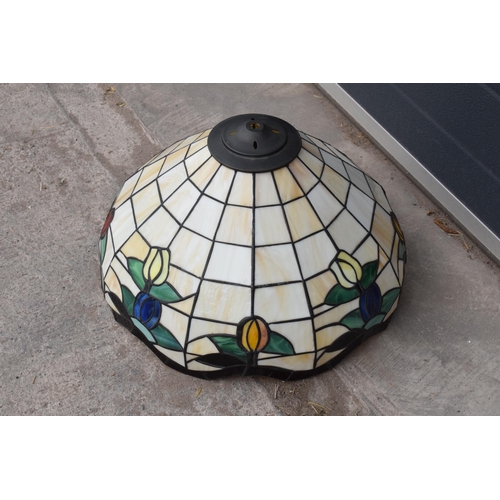 364 - A large Tiffany - style domed lampshade with floral decoration. 45cm diameter.