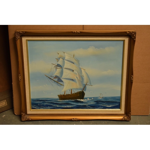 371 - A 20th century oil on canvas style print depicting a sailing ship at sea bearing signature to bottom... 