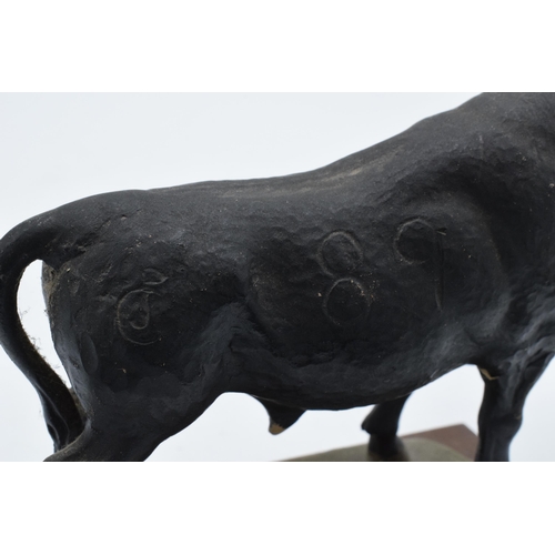 380 - An unusual 20th century cast plaster figure of an Aberdeen Angus Bull with signature to verso. Some ... 