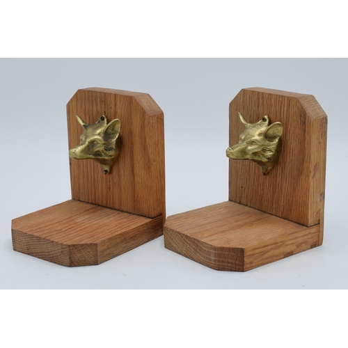 397 - A pair of wooden bookends with cast brass foxes head (2). 13cm tall.