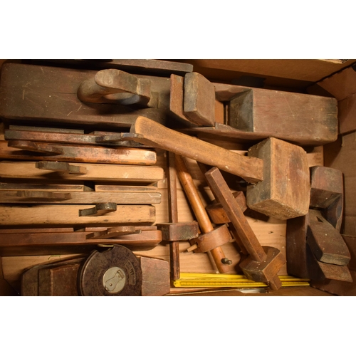 406 - A collection of vintage tools to include planes, tape measures, gauges, a mallet, vintage saws etc (... 