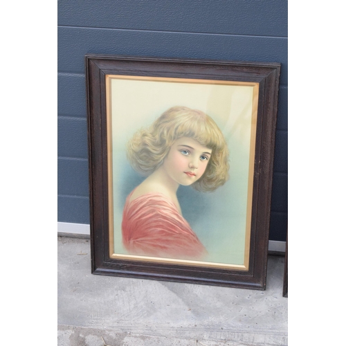 416 - A pair of early 20th century prints of young girls in wooden frames (2). 61 x 47cm inc frames.