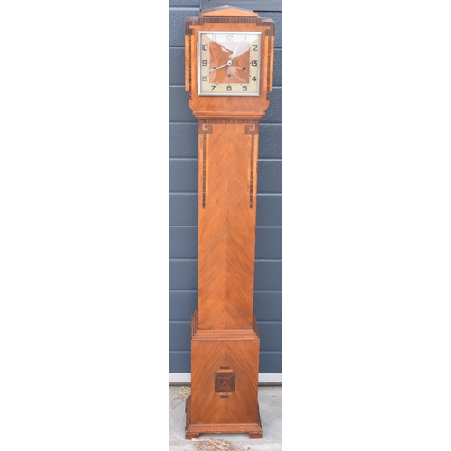 418 - An art deco oak cased granddaughter clock by Haller. 140cm tall. Untested.