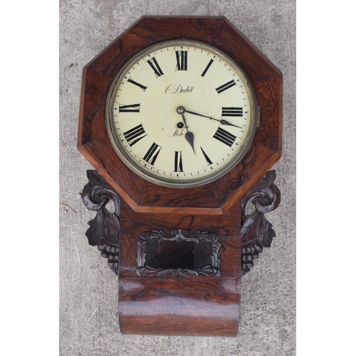 419 - A late 19th / early 20th century drop dial wall clock with carved grape vine decoration 'C Duckett' ... 