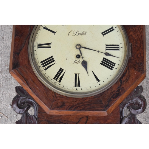 419 - A late 19th / early 20th century drop dial wall clock with carved grape vine decoration 'C Duckett' ... 