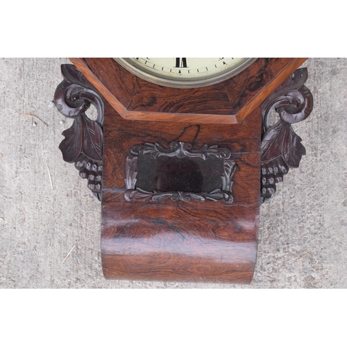 419 - A late 19th / early 20th century drop dial wall clock with carved grape vine decoration 'C Duckett' ... 