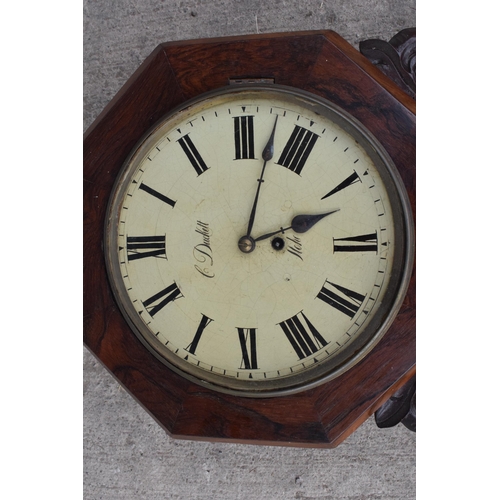 419 - A late 19th / early 20th century drop dial wall clock with carved grape vine decoration 'C Duckett' ... 