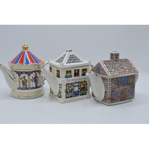 65A - A trio of teapots to include Sadler examples 17th Century Cottage, Band Stand and Wade English Life ... 