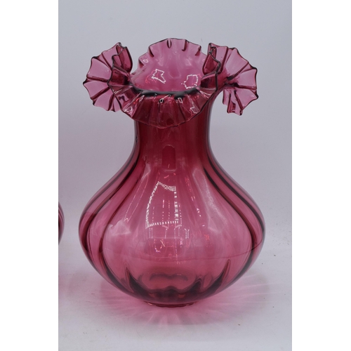 68 - A pair of large vintage cranberry glass low-shouldered baluster vases with shaped rims (2). 28cm tal... 