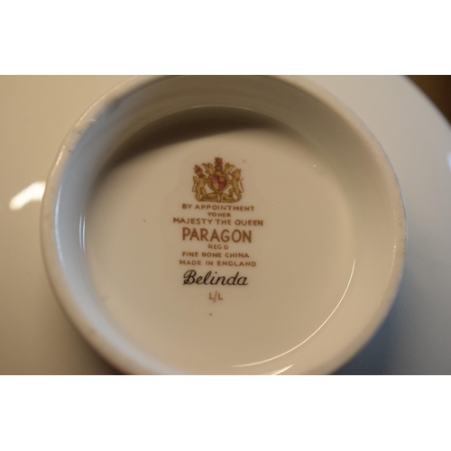 69 - A large collection of Paragon fine bone china tea and dinner ware in the Belinda pattern to include ... 