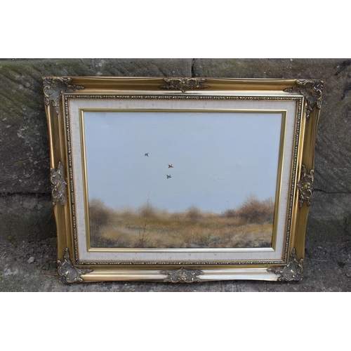 349B - T Lukkien oil on canvas in gilt frame of mallards in flight over marshes. 53 x 43cm inc frame.